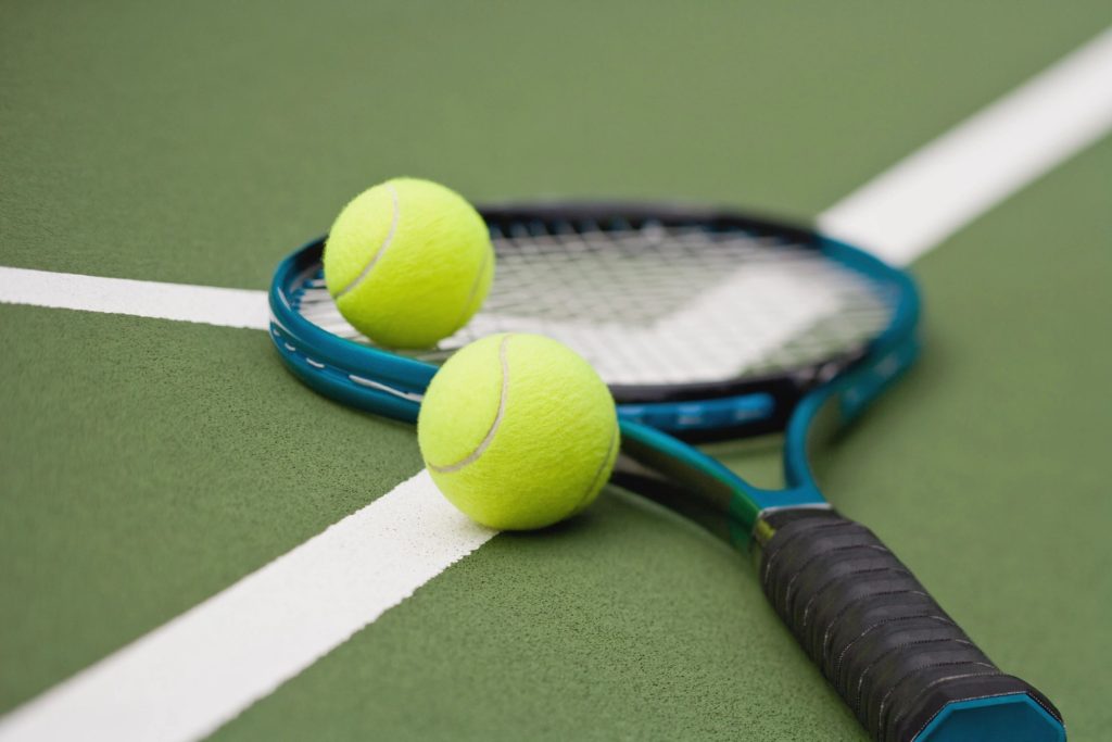 Image of racket and tennis balls.